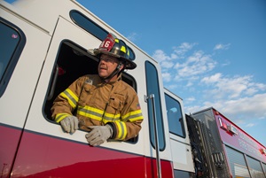 Beau hanging out of fire truck window